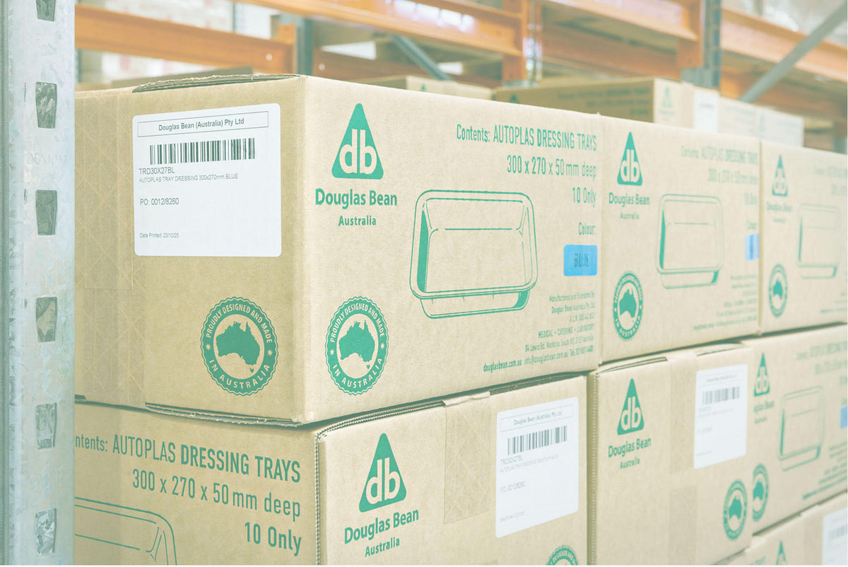 Cartons of Autoplas dressing trays on the racking, marked proudly designed and made in Australia