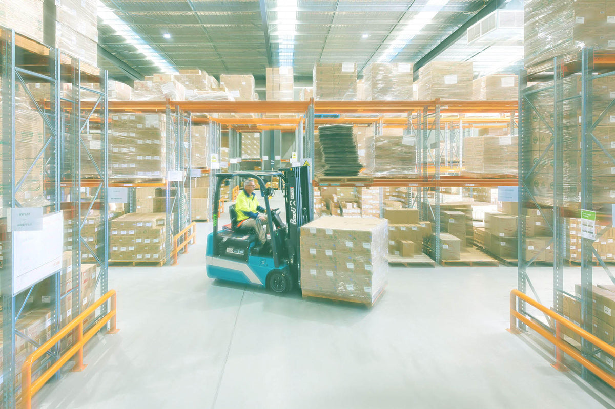 A forklift moving a pallet through the Douglas Bean Australia warehouse